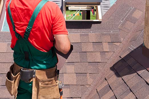 contractor-repairing-roof-shingles